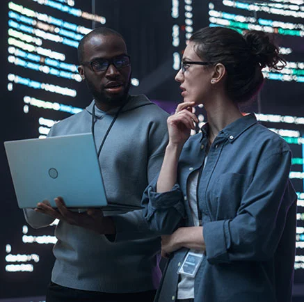 Image of two people discussing measurement science and trustworthy AI